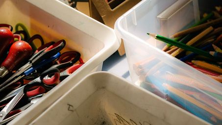 Photo: Boxes of crayons, pencils, scissors and colourful tapes.