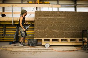 Photo: Chiselling the groove on prefabricated clay elements